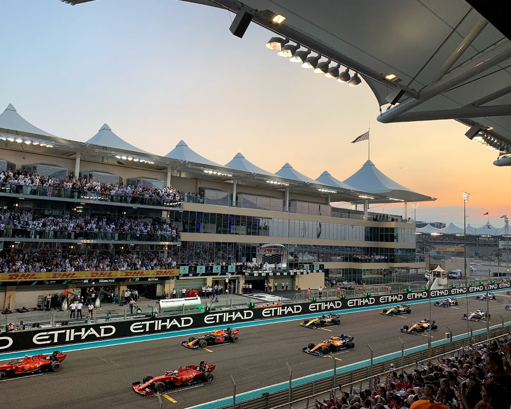 Formula 1 Abu Dhabi Grand Prix racing circuit with dramatic evening lighting